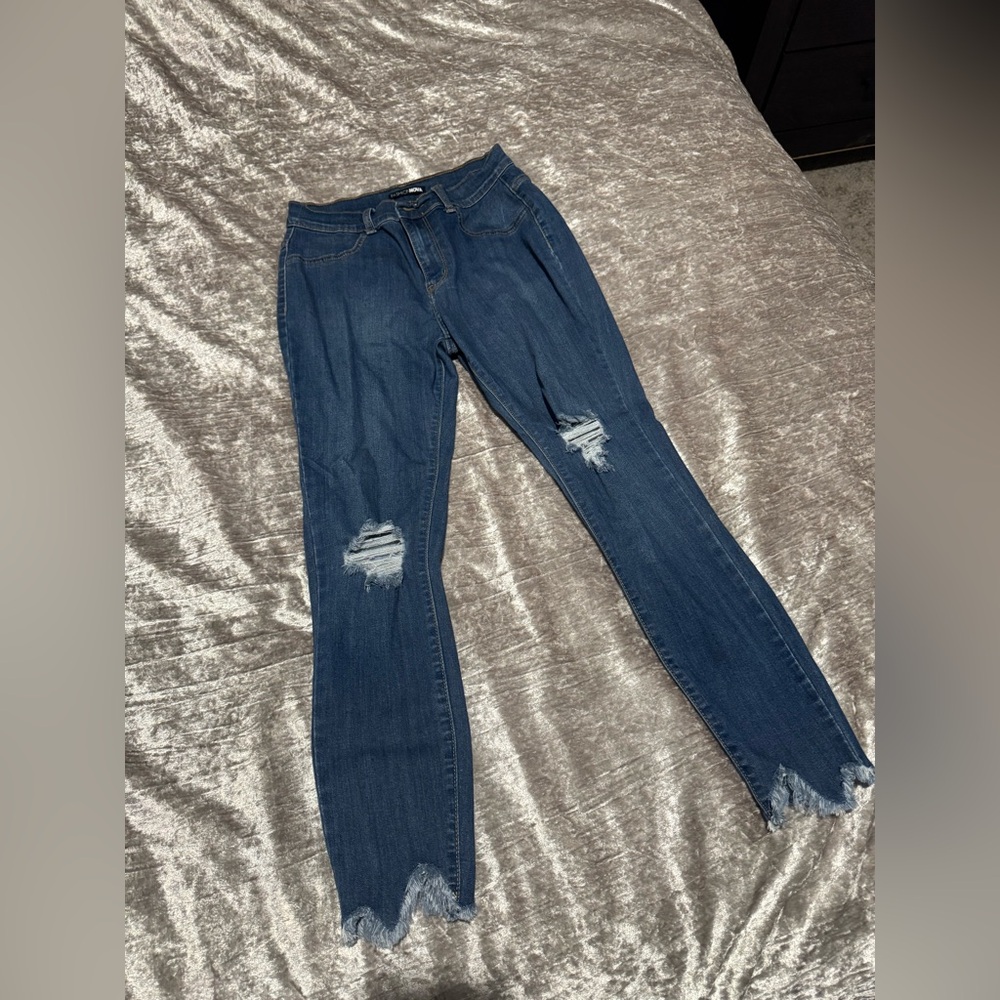Distressed Blue Jeans with Frayed Hem
